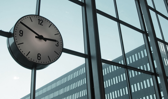 Clock with a building in the background